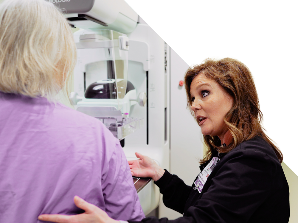 A doctor explaining a mammogram to a patient