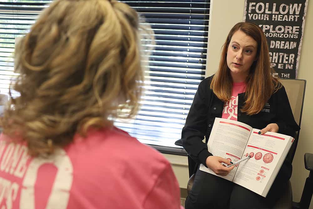 A Breast Health Navigator with a patient