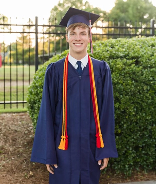 A young graduate in robes