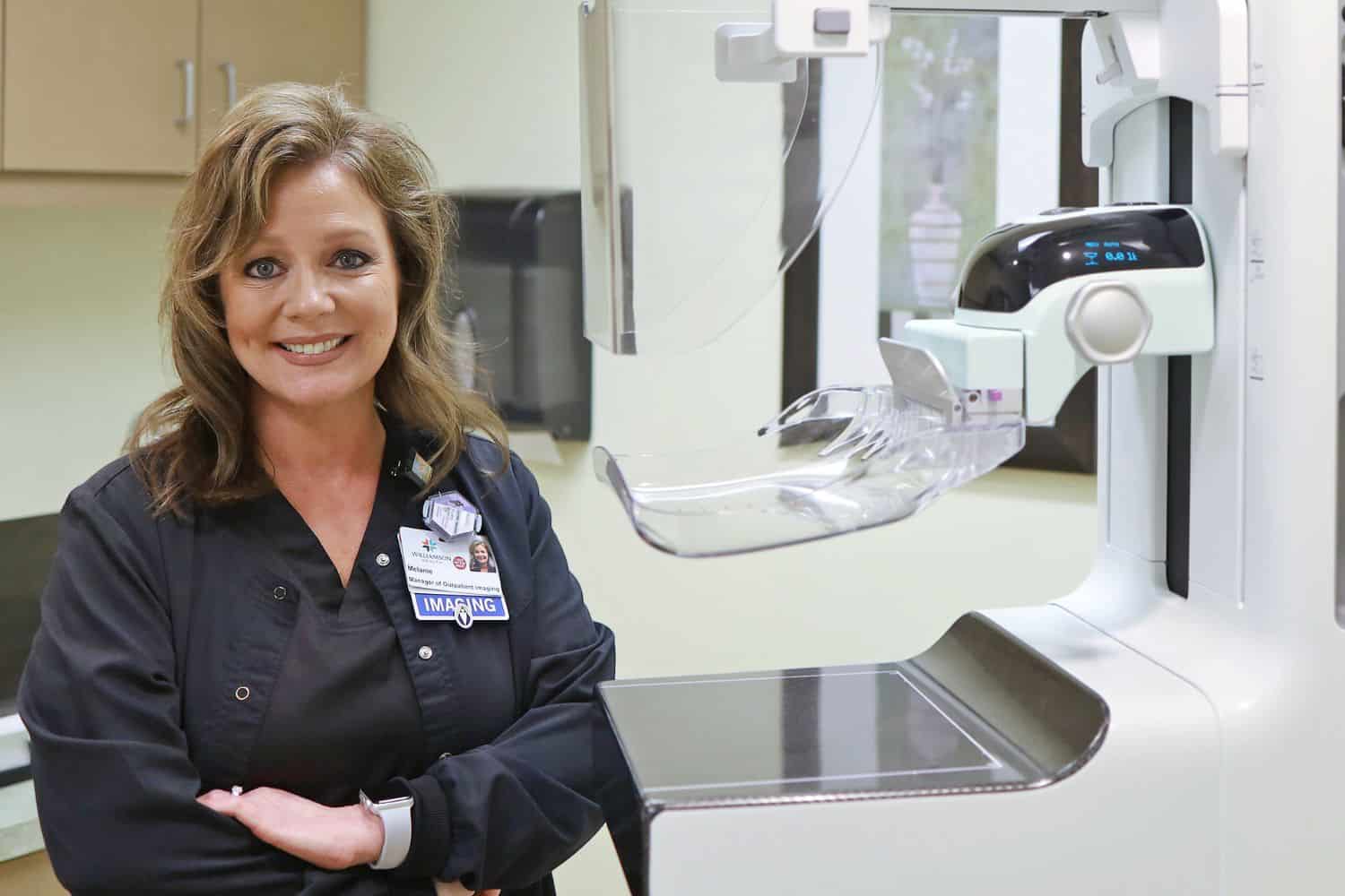 A doctor with the mammogram machine